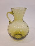 Petite olive green handblown optic glass pitcher with applied handle, full front view — vintage coastal decor