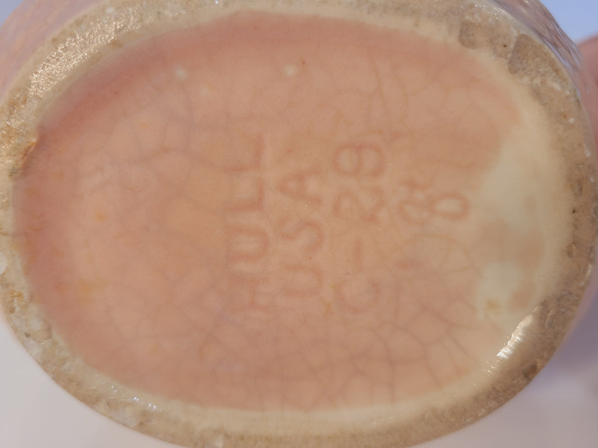 Close-up of bottom of Hull Pottery Nuline pitcher spout showing makers mark