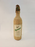 Roncoco Coconut Rum Liqueur wicker-wrapped bottle, front label, Ron Matusalem 1970s–80s coastal or tiki barware decor
