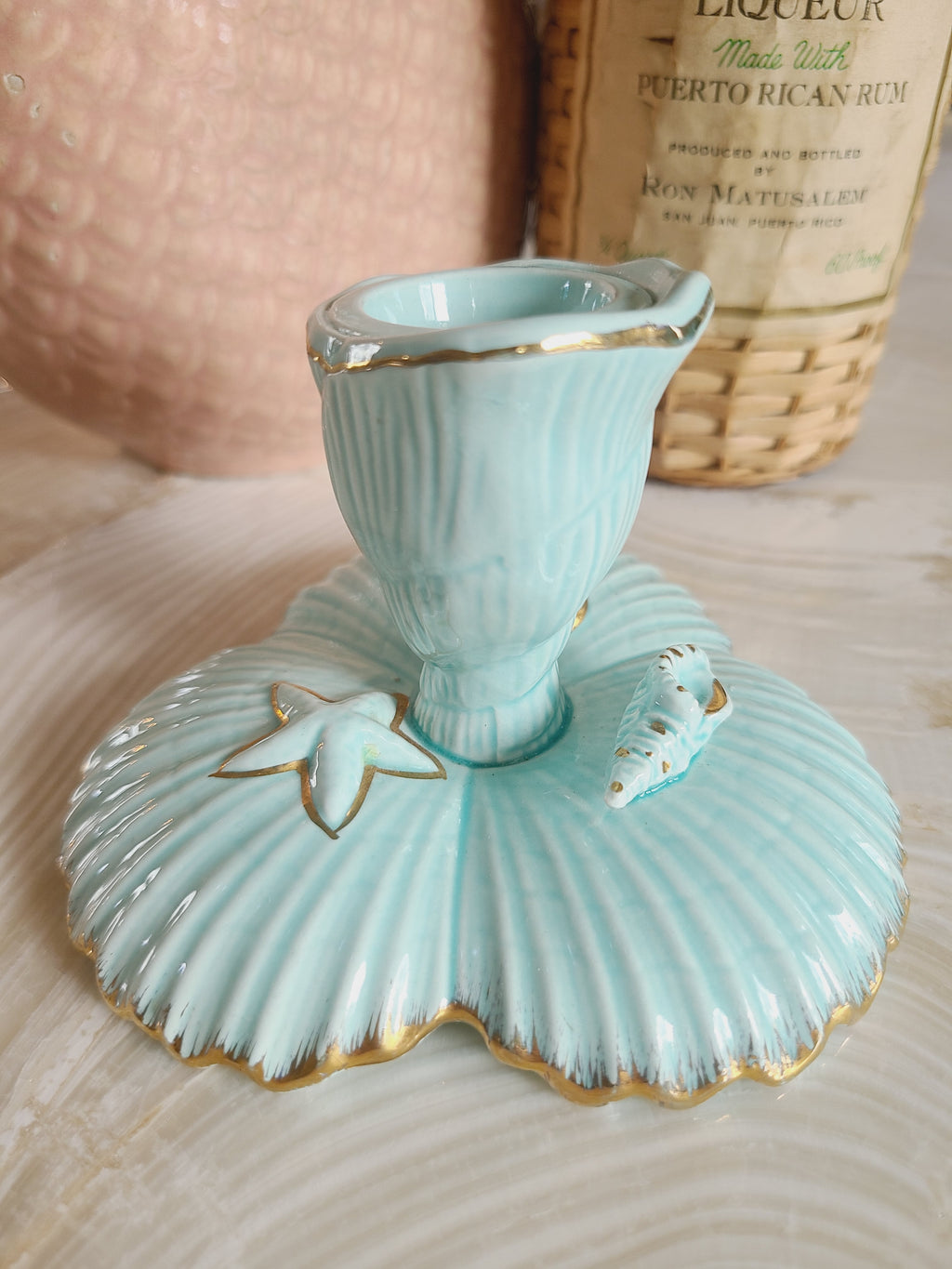 1962 NAPCO Tropic Sea aqua ceramic taper candle holder with scallop base, starfish and shell accents, gold trim, coastal decor vignette