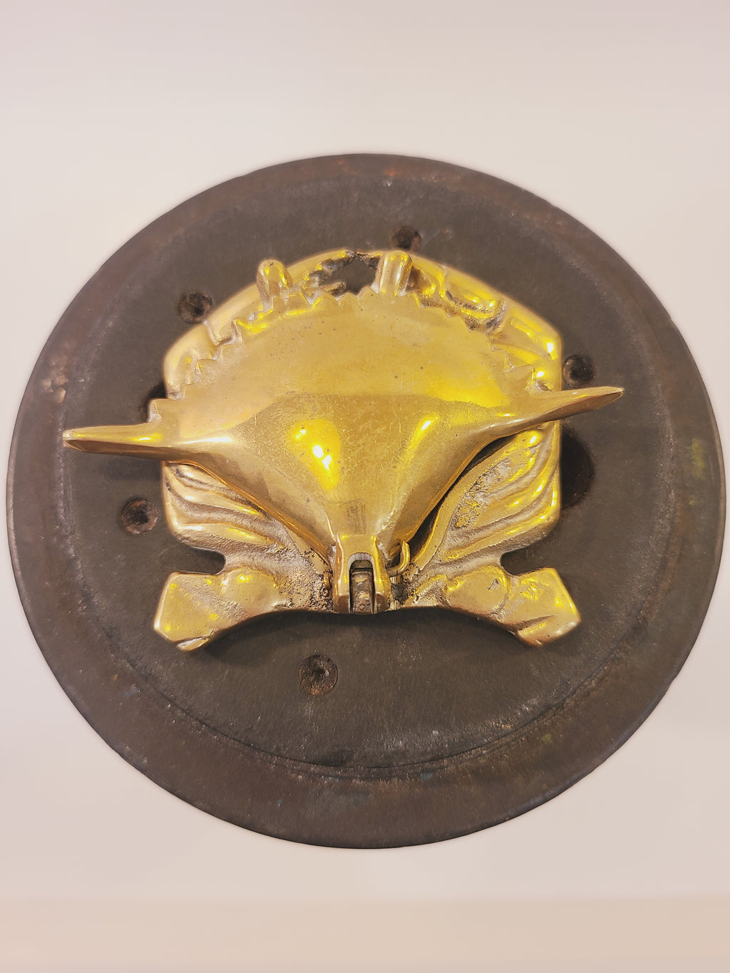 Top view of a solid brass crab trinket box with detailed claws, legs, and shell