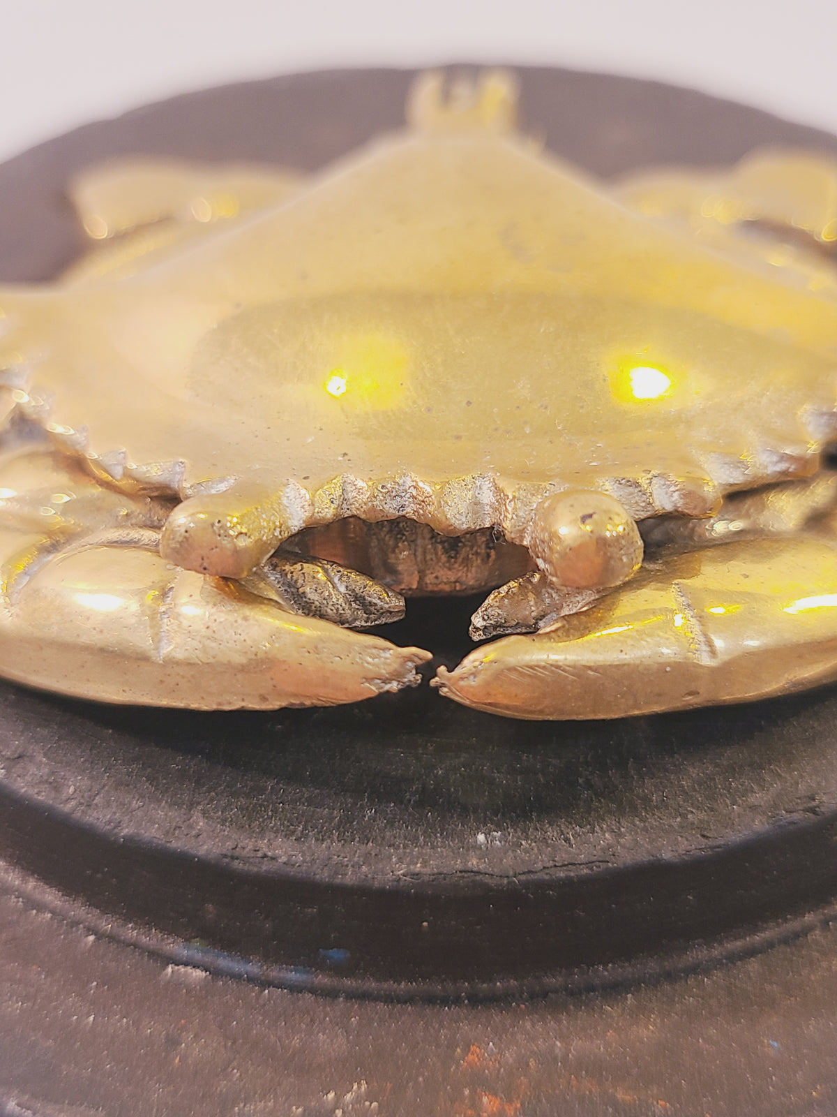 Close-up of the brass crab trinket box showing eyes and claws