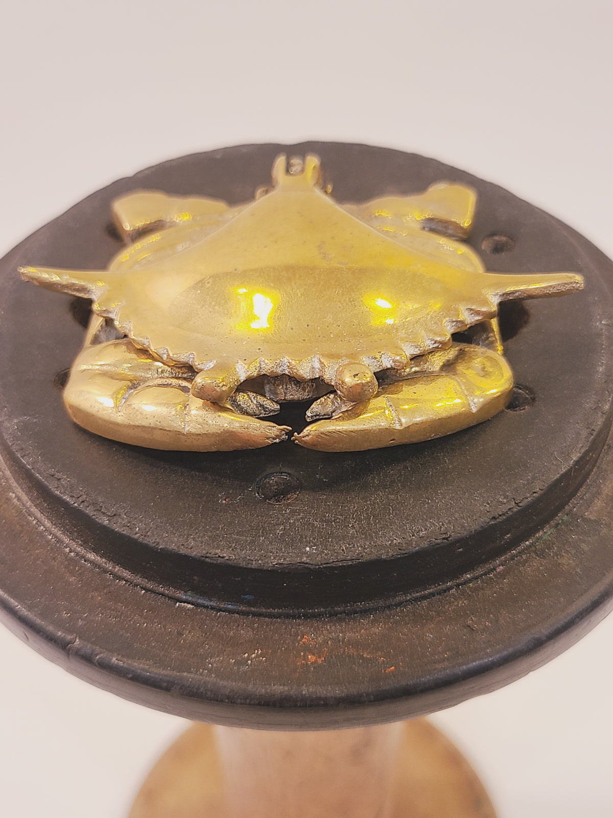 Solid brass crab trinket box shown from above with its hinged shell closed
