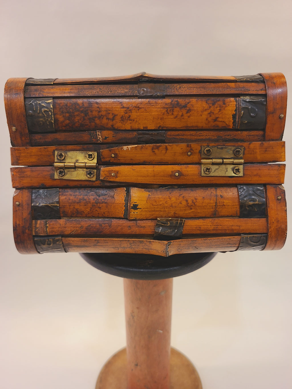 Bottom of vintage bamboo box handbag showing its brass hardware