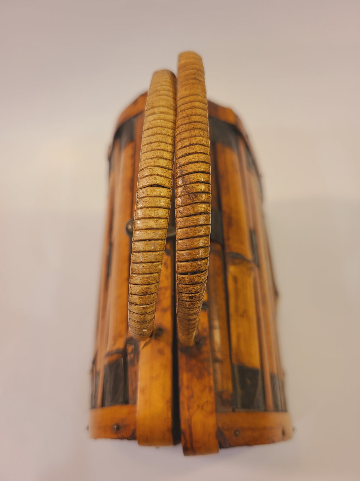 Top view of a vintage bamboo box handbag showing its paired woven handles