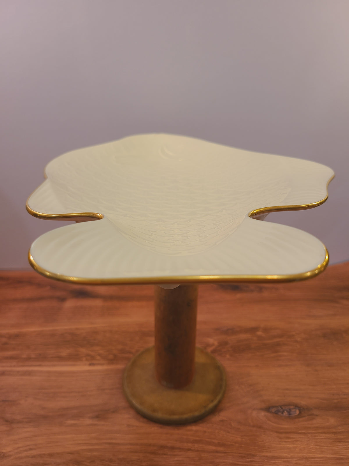 Lenox fish-shaped serving platter showing its ivory china body and gold-trimmed outline